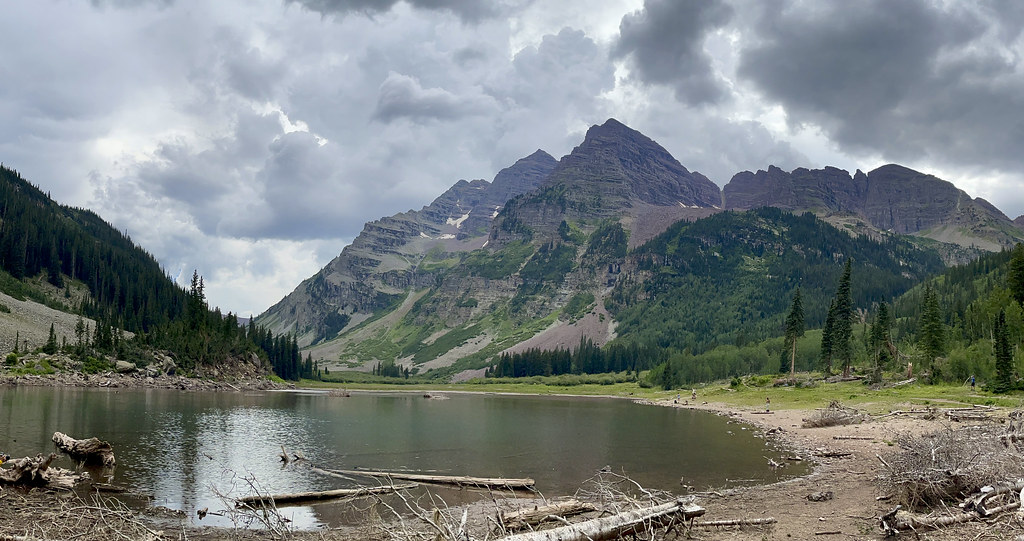 Looking back at Maroon and North Maroon from Crater Lake with storm clouds fully formed above them. {768x406}